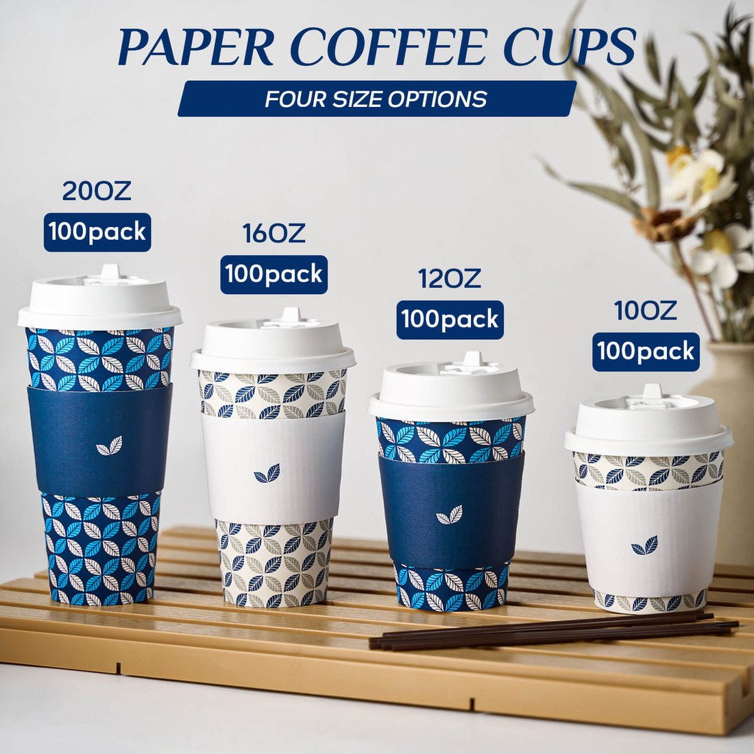 Four sizes of Jolly Chef paper coffee cups displayed on a wooden tray with decorative patterns, labeled with their capacities and pack sizes.