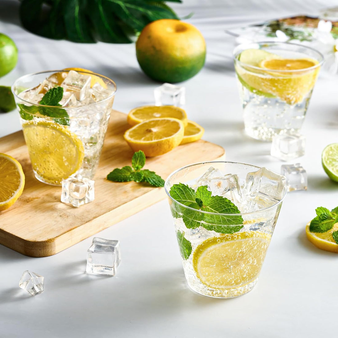 Jolly Chef blog cover from October 2024 Glasses of refreshing drinks with lemon slices, mint, and ice cubes sit on a white surface, surrounded by lemon cuts, limes, and a wooden board.