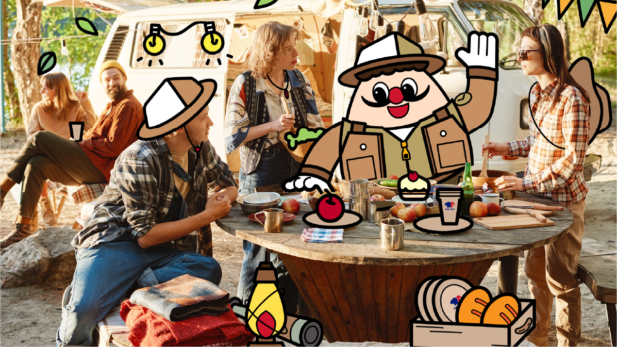 A group of friends gather around a rustic table filled with food and drinks, enjoying a fun outdoor camping experience with outdoor fit Jolly Chef mascot.
