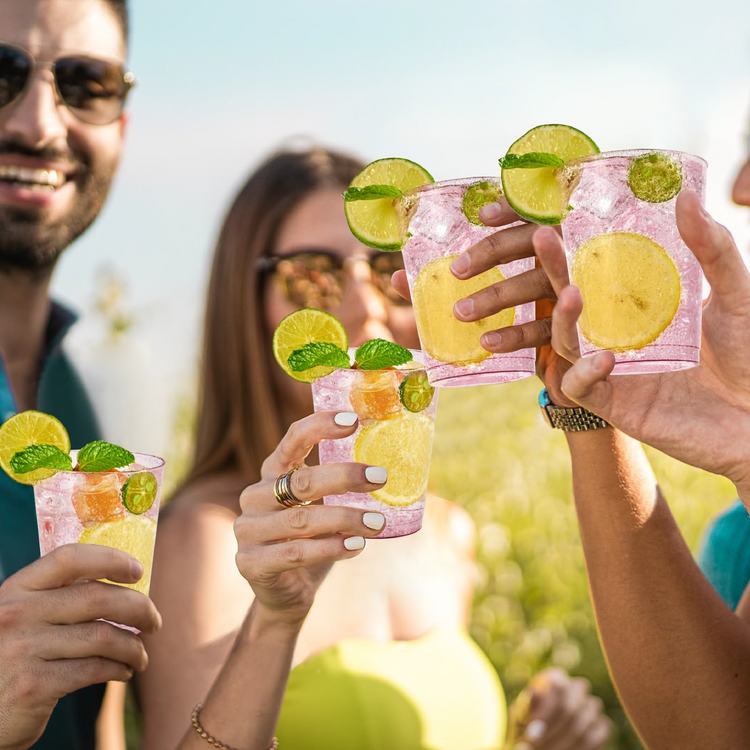 Jolly Chef For Party Use Collection Main Image that is a group of friends joyfully raising colorful cocktails garnished with lime and mint in a sunny outdoor setting.