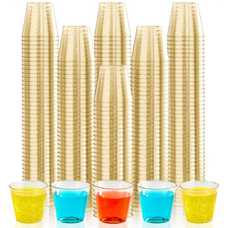 A stack of gold plastic cups towers behind colorful drinks: red, blue, and yellow in clear Jolly Chef plastic cups, set against a white background.