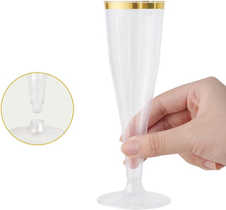 A hand holding a clear, elegant Jolly Chef 4.5oz Clear Gold Rim Champagne Flutes with a gold rim, alongside a close-up of its detachable base.