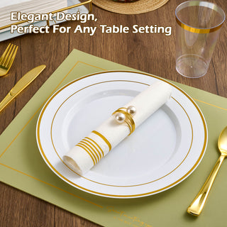 1 piece of Jolly Chef 3 Ply Golden Stripe Classic Paper Napkin is wrapped with golden jewelry strap and placed on the white plate on the green map and wooden table with spoon, fork and knife beside it