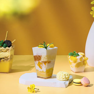 Jolly Chef clear plastic cups filled with layered desserts—including one with cream, fruit, and rosemary.