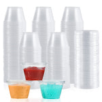 Stack of clear plastic portion cups with lids, some filled with ketchup, orange sauce, and blue tapioca pearls.