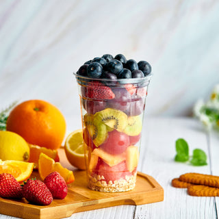 Clear PET cup layered with fresh blueberries, strawberries, grapes, kiwi slices, and granola.