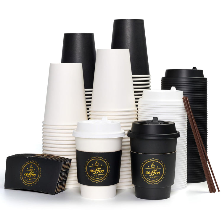 A variety of disposable Jolly Chef Black&White Coffee Cups With Lids&Sleeves&Stirrers, stacked in white and black, alongside chocolate-colored coffee sleeves and wooden stirrers.