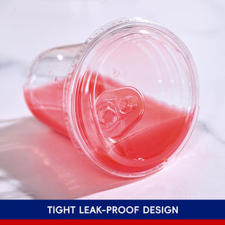 Clear cup with Jolly Chef Plastic(PET) Sip Lids, filled with pink liquid, sitting on a smooth surface with a focus on its secure design.