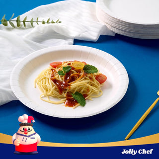 White paper plate with spaghetti, cherry tomatoes, and mint. Stacked paper plates and Jolly Chef character in background.