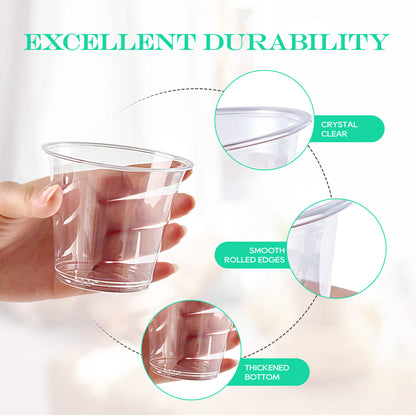A hand holds a clear plastic cup showcasing its features: crystal clarity, smooth edges, and a thickened bottom for durability.