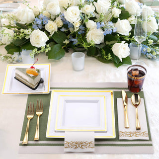 Elegant wedding reception table decor with floral centerpiece and gold-rimmed plates.