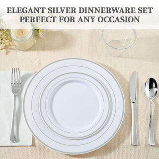 Elegant silver dinnerware set with plates, cutlery, and a candle, perfect for any occasion.