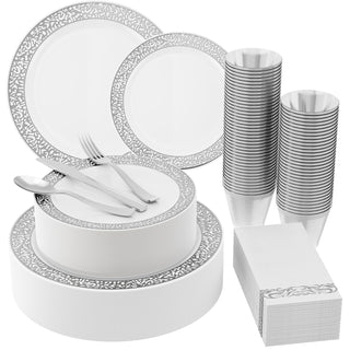A set of elegant white disposable Jolly Chef tableware featuring silver patterned edges, including plates, utensils, cups, and napkins.