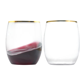 Two elegant Jolly Chef Clear Stemless Gold Rim Plastic Wine Glasses side by side: one filled with dark red wine, the other clear and empty, both featuring gold rims.