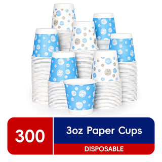 A stack of colorful JOLLY CHEF 3 oz Paper Cups – 300 Count, Small Bathroom Cups, Disposable Mouthwash Cups, Espresso Cups, Mini Cup for Coffee, Tea, Water, Snack, featuring blue patterns with white and silver polka dots, totaling 300 cups.