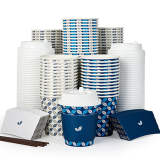 A display of Jolly Chef Blue&Grey Leaf Pattern Coffee Cups With Lids&Sleeves & Stirrers in various leaf-patterned designs.