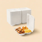 White compostable sugarcane clamshell container with chicken wings, fries, and popcorn chicken.