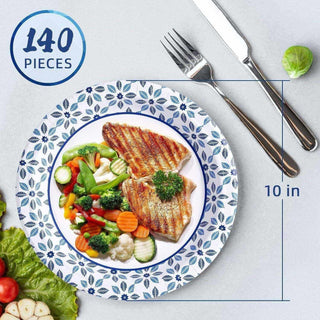 Grilled fish served with mixed vegetables on a decorative jolly chef blue-patterned plate, accompanied by a fork and knife.