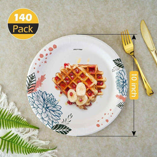 A 10-inch decorative jolly chef paper plate featuring waffles topped with bananas and pomegranates, alongside gold utensils and greenery.