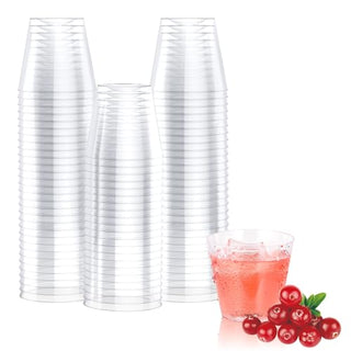 A stack of clear Jolly Chef plastic cups beside a filled cup of pink drink and fresh cranberries, on a white background.